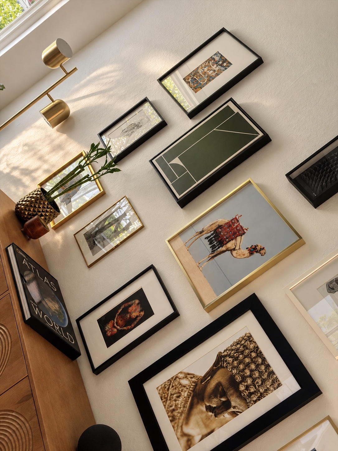 An angled close-up view of a framed gallery wall and sideboard